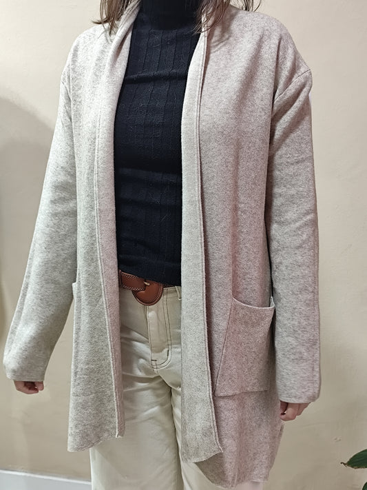 Cárdigan largo en tejido grueso con bolsillos